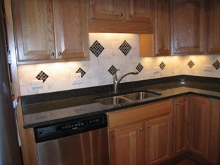 HMI Remodeling-Hoske Maintenance-new cabinet, granite countertops, cermamic backsplash and recessed lighting.