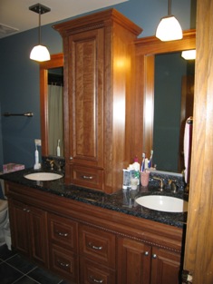 HMI Remodeling-Hoske Maintenance-bathroom room remodeling with custom cabinets, granite top, faucets, tub, toilet and shower, with new mirrors and light fixtures to match design.