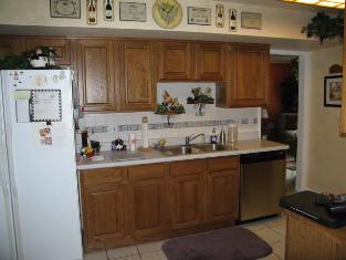 HMI Remodeling-Hoske Maintenance-Installed new cabinets, ceramic tile backsplash and floor and Formica-brand countertops.