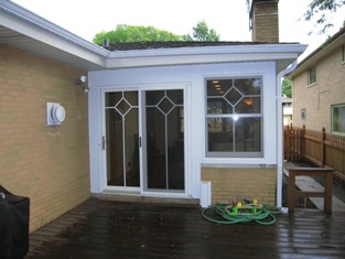 HMI Remodeling-Hoske Maintenance-rebuilt family room including windows and patio door and interior (not shown).